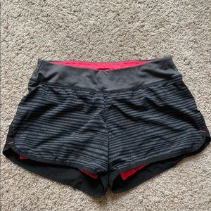 Women’s black running shorts with neon lining. Size Small